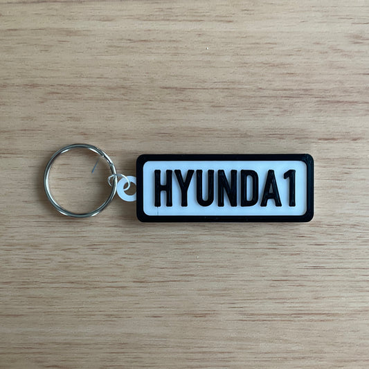 a picture of the Hyundai keychain with black lettering and boarder on white background.