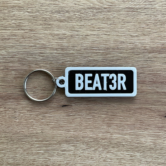 a picture of the beater keychain with the black background.
