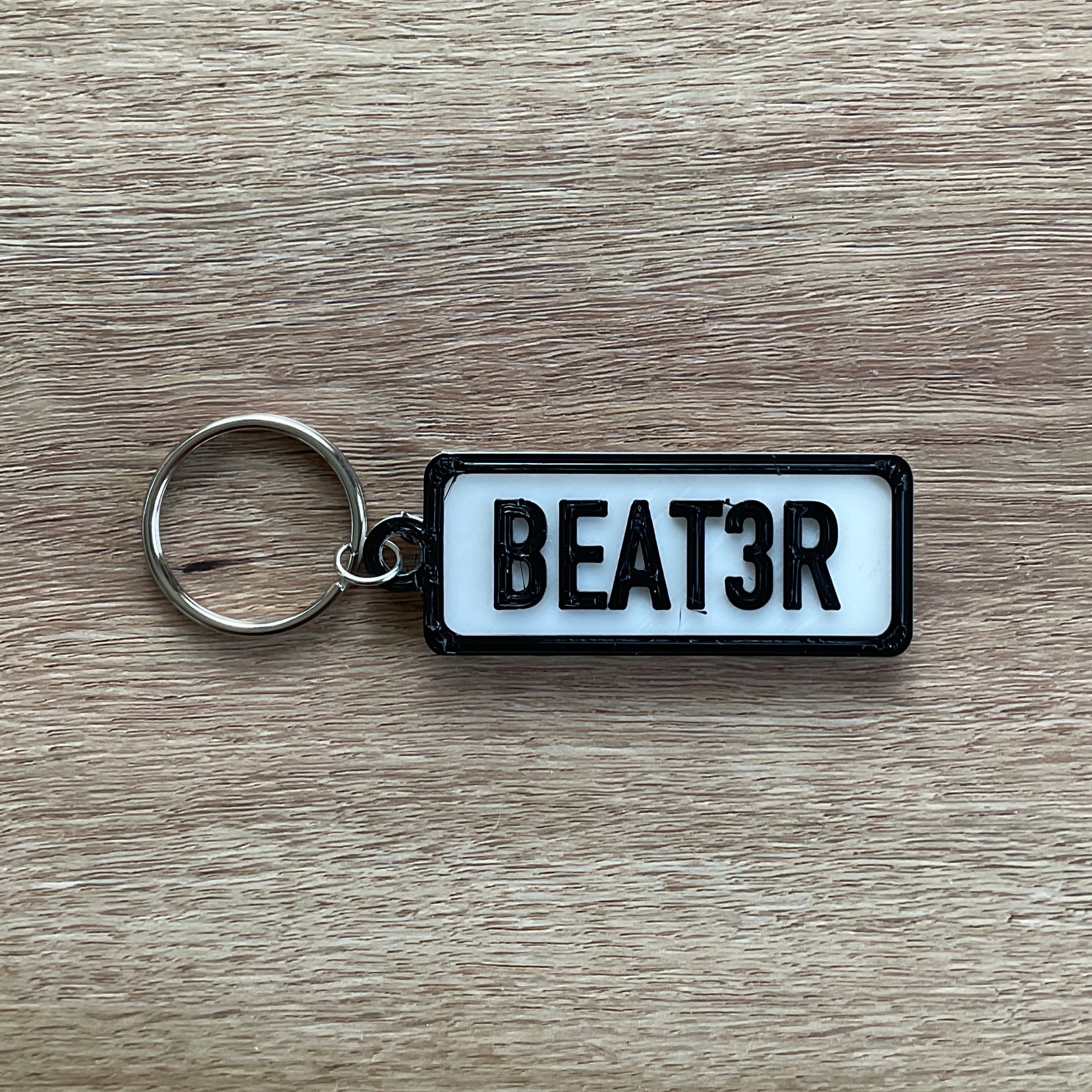 a picture of the beater keychain with the white background.
