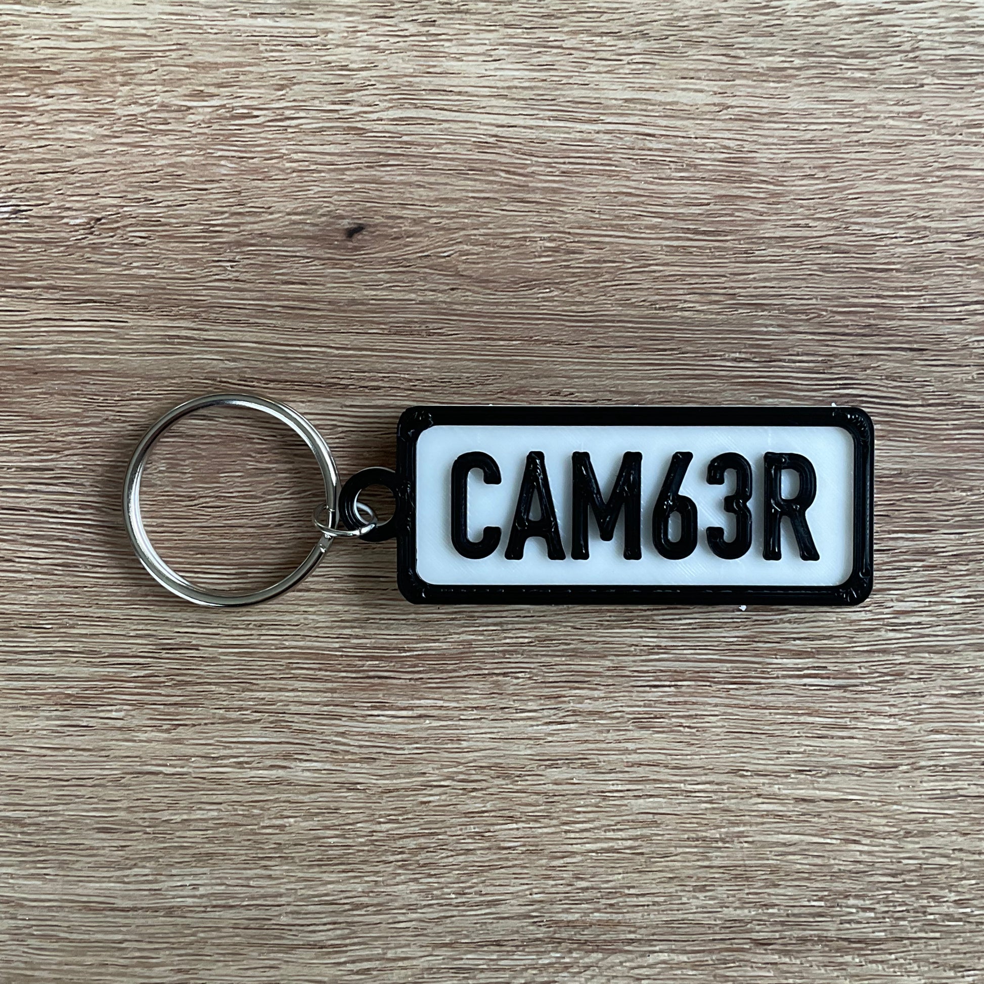 a picture of the camber keychain with the white background