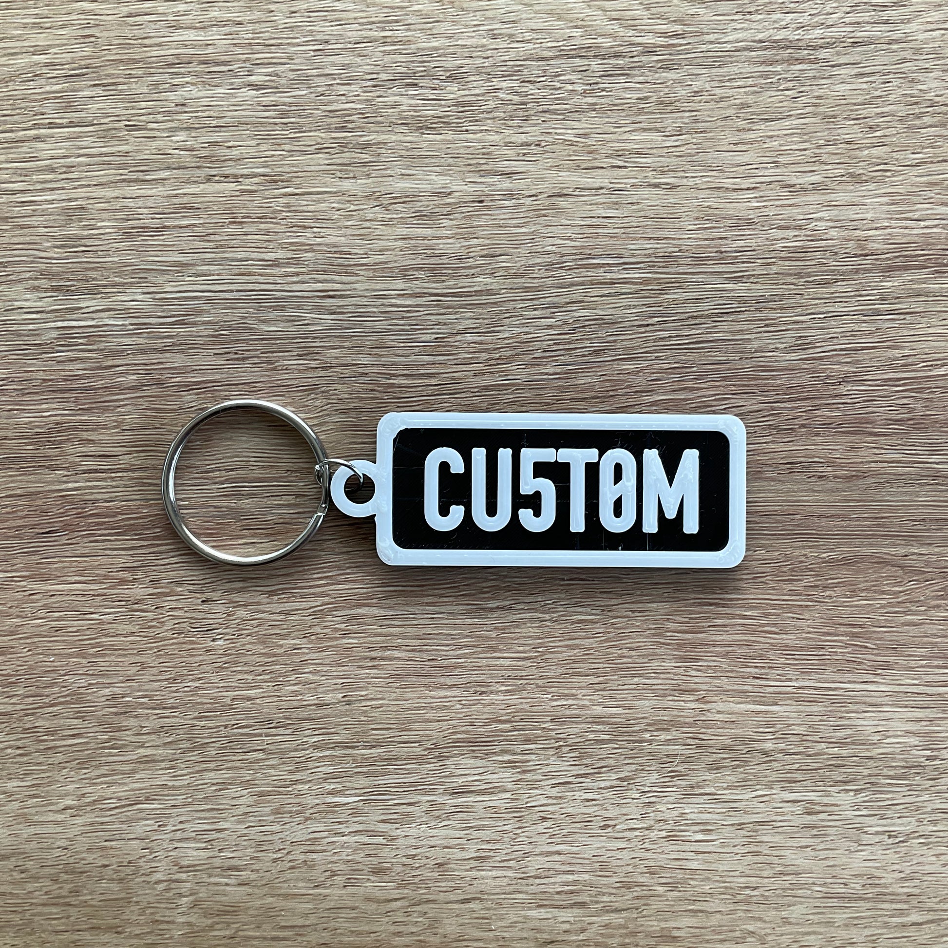 a picture of the custom keychain with the black background