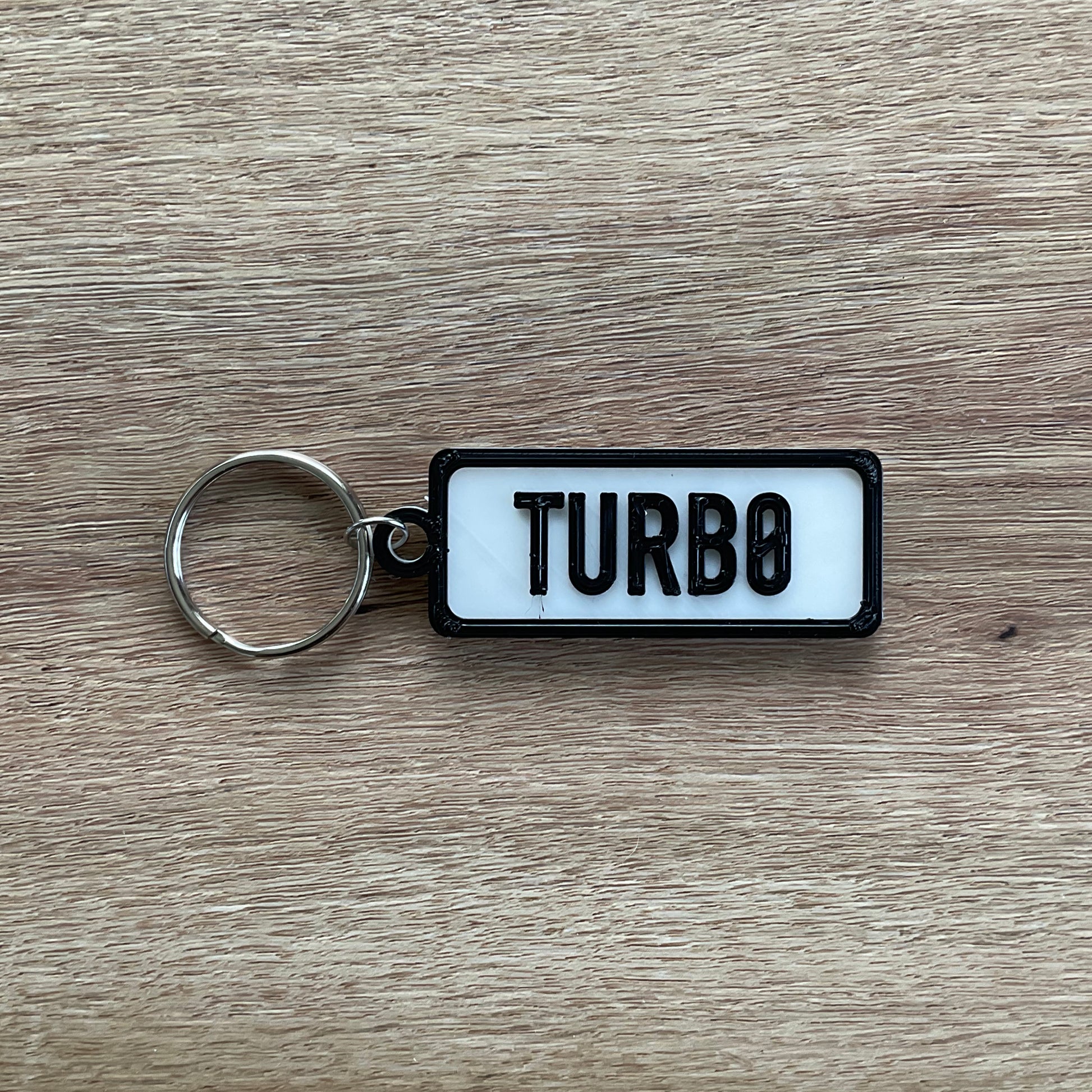 a picture of the turbo keychain with the white background.
