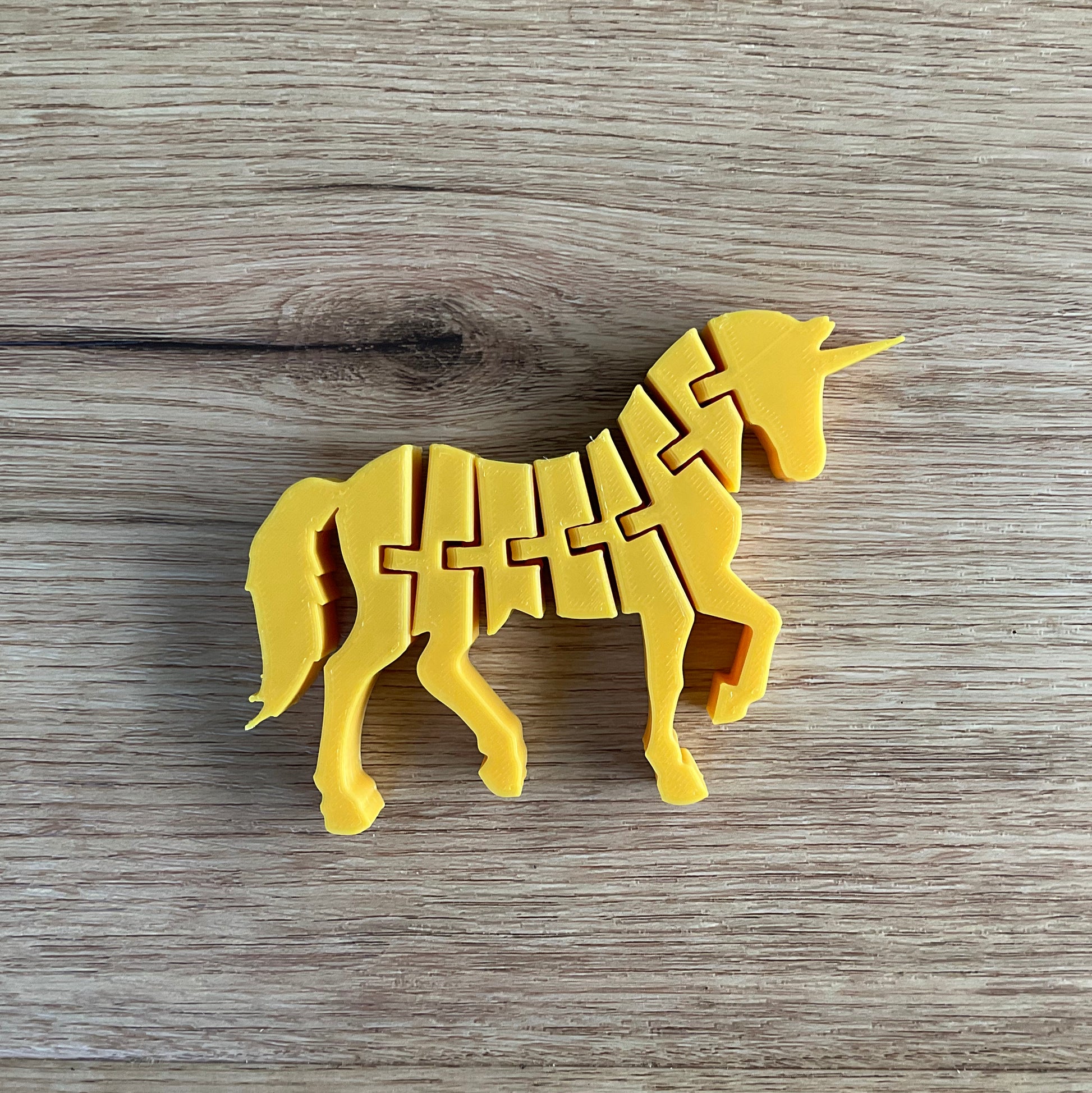 An image of the gold articulated unicorn